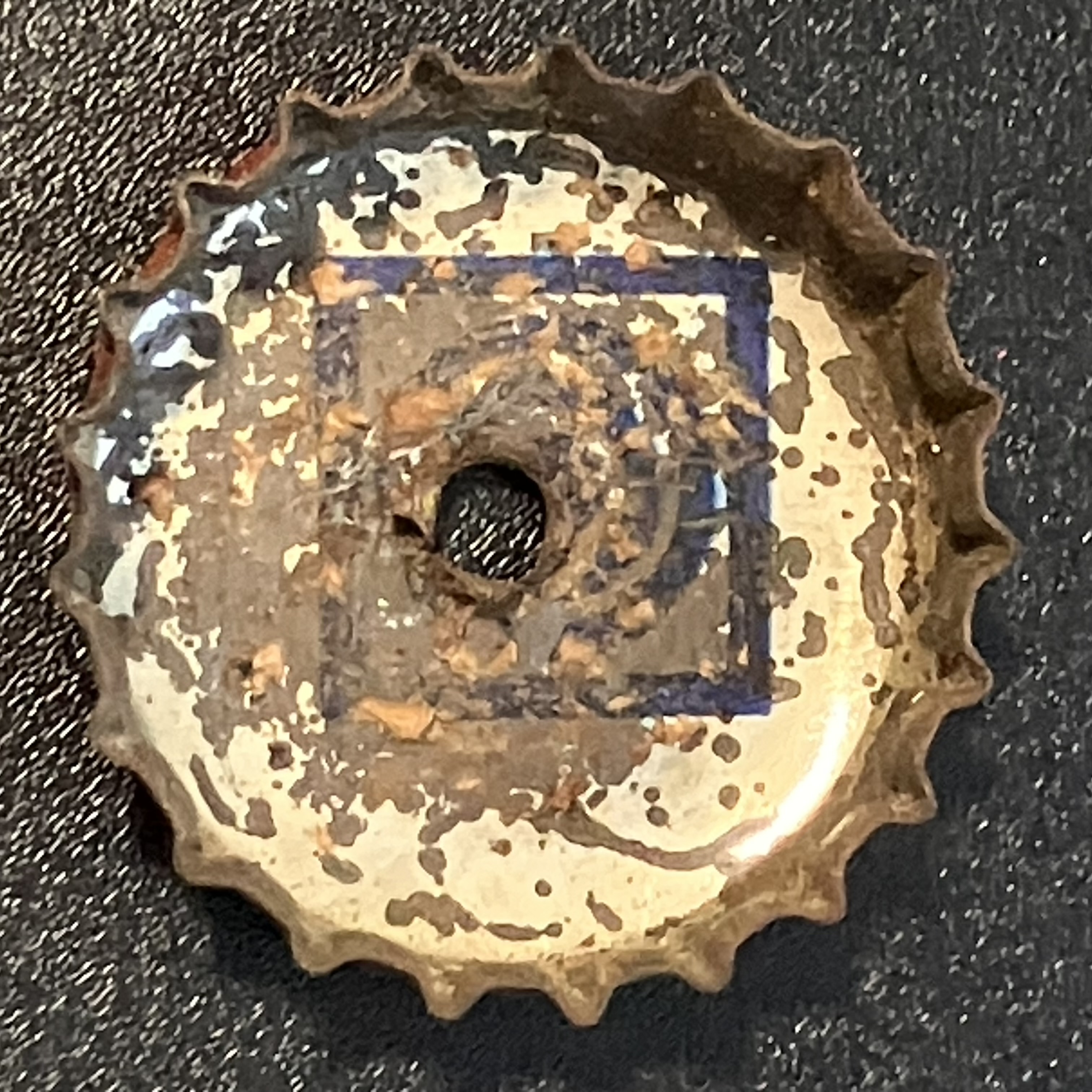 crown-cap liner of unadvertised variant